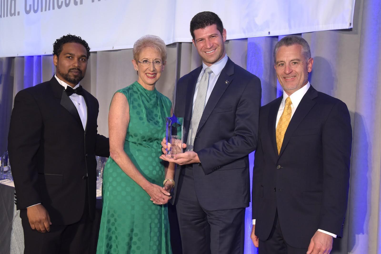 Dr. Goldwaser on stage receiving an award in Connecticut